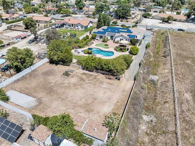 aerial perspective of suburban area featuring a pool area