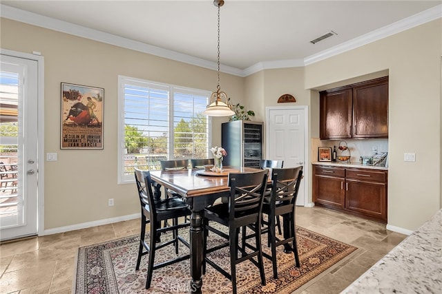 dining space with ornamental molding, baseboards, light stone finish flooring, and wine cooler