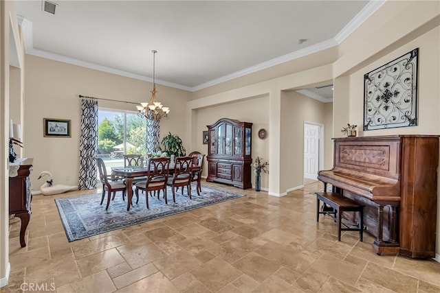dining space with stone tile floors, ornamental molding, a chandelier, and baseboards