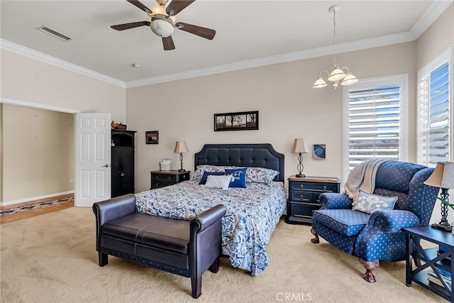 bedroom featuring carpet floors, crown molding, a chandelier, ceiling fan, and baseboards