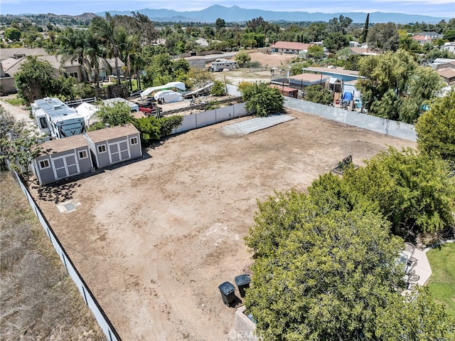 aerial perspective of suburban area with a mountainous background