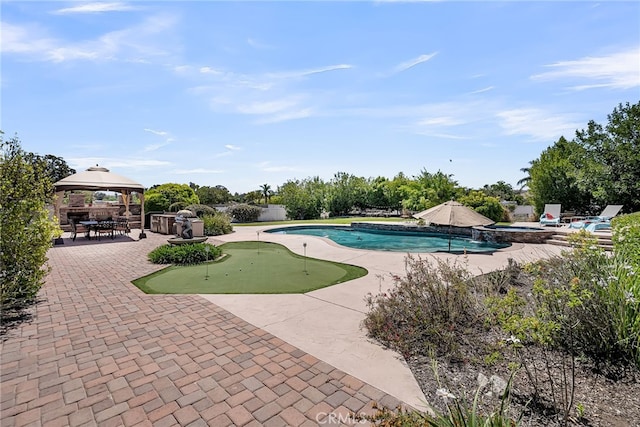 view of swimming pool with a putting green, a patio area, a gazebo, and a pool with connected hot tub