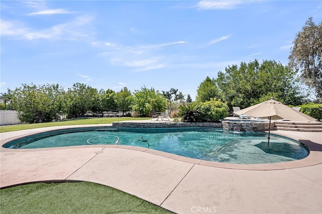 view of pool featuring a patio and a pool with connected hot tub
