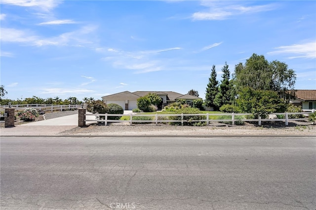 view of front of property with driveway and a garage