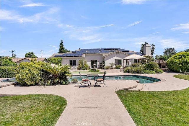 swimming pool featuring a patio, a yard, and a gazebo