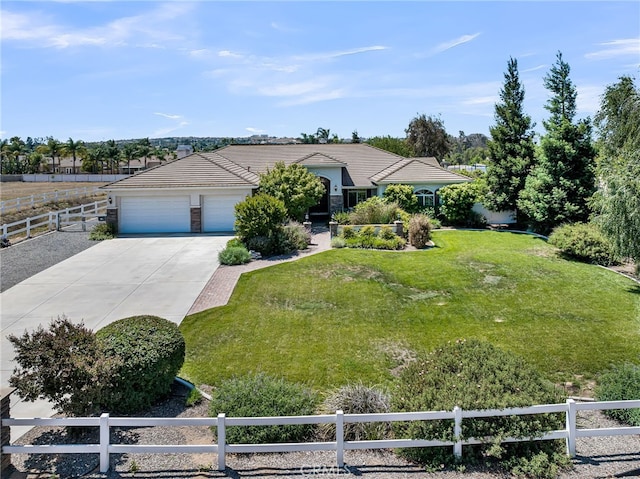 ranch-style house featuring driveway, a garage, and a tiled roof