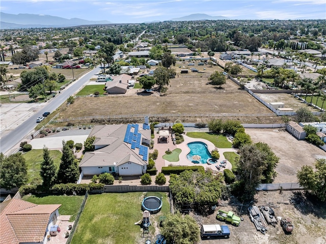 aerial view of mountains and a pool