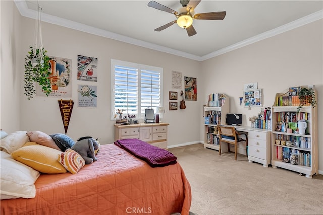 carpeted bedroom featuring crown molding, a ceiling fan, and baseboards