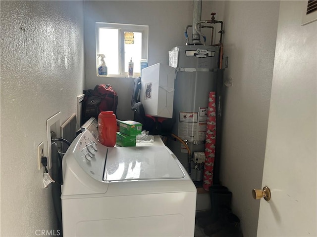 2789 Spencer Ave, Oroville, CA 95966 - laundry area with washer / clothes dryer and strapped water heater