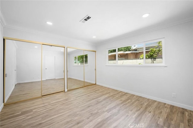 575 Winona Way, Pasadena, CA 91103 - unfurnished bedroom with two closets, wood finished floors, baseboards, ornamental molding, and recessed lighting