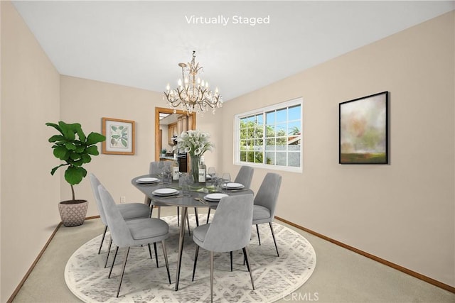 2148 Aquinas Ave, Claremont, CA 91711 - dining area featuring carpet flooring, a chandelier, and baseboards