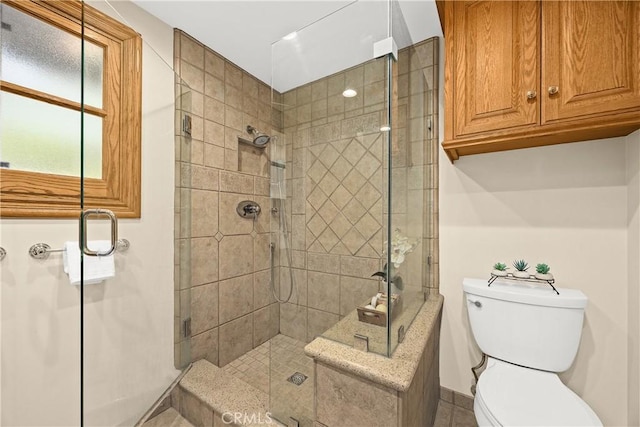 2148 Aquinas Ave, Claremont, CA 91711 - bathroom featuring a stall shower, toilet, and baseboards