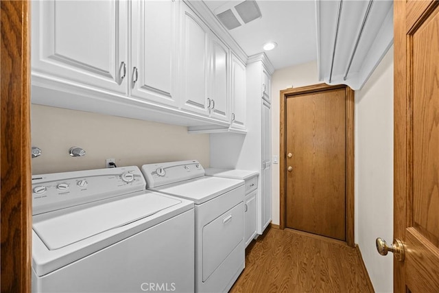 2148 Aquinas Ave, Claremont, CA 91711 - washroom with washing machine and clothes dryer, cabinet space, light wood finished floors, and recessed lighting