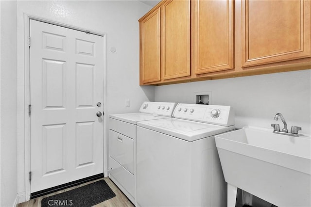 16702 Hastings Pl, Victorville, CA 92395 - laundry area with separate washer and dryer, cabinet space, and light wood finished floors