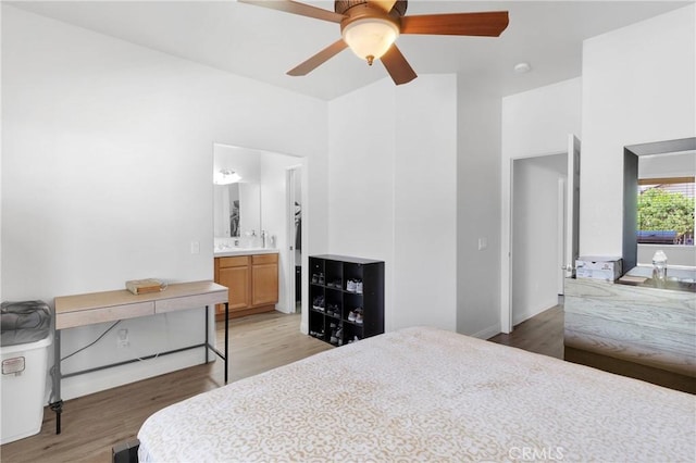 16702 Hastings Pl, Victorville, CA 92395 - bedroom featuring light wood-type flooring, a towering ceiling, ceiling fan, ensuite bath, and baseboards