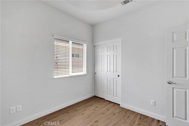 16702 Hastings Pl, Victorville, CA 92395 - unfurnished bedroom featuring light wood finished floors, baseboards, and a closet