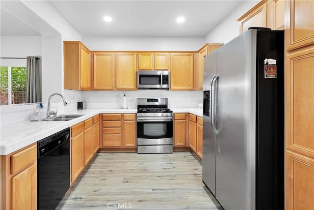 16702 Hastings Pl, Victorville, CA 92395 - kitchen featuring stainless steel appliances, a sink, light wood-style floors, recessed lighting, and light brown cabinetry