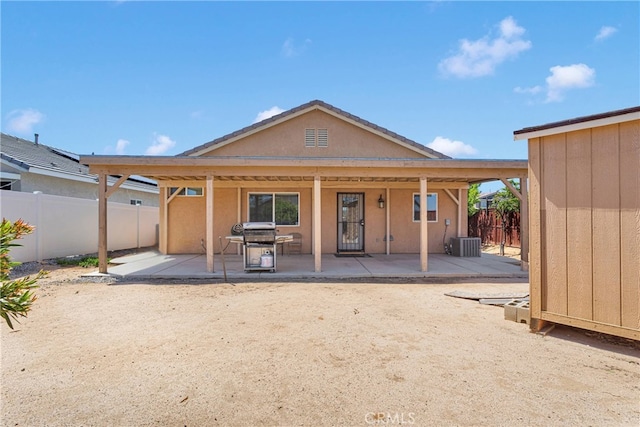 16702 Hastings Pl, Victorville, CA 92395 - back of house featuring a patio area, central AC unit, and stucco siding