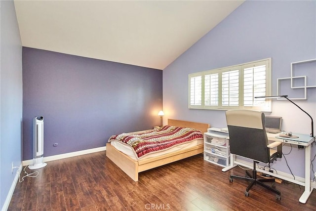 bedroom featuring vaulted ceiling, wood finished floors, and baseboards