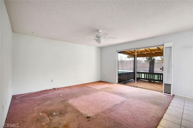 638 W Villa Chaparral Rd, San Jacinto, CA 92583 - tiled empty room featuring a ceiling fan and a textured ceiling