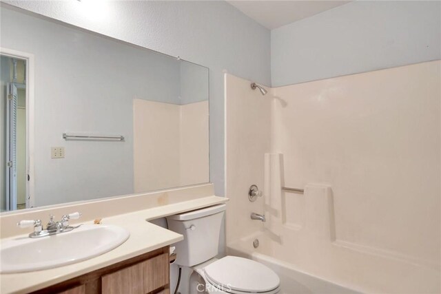 638 W Villa Chaparral Rd, San Jacinto, CA 92583 - bathroom featuring tub / shower combination, vanity, and toilet
