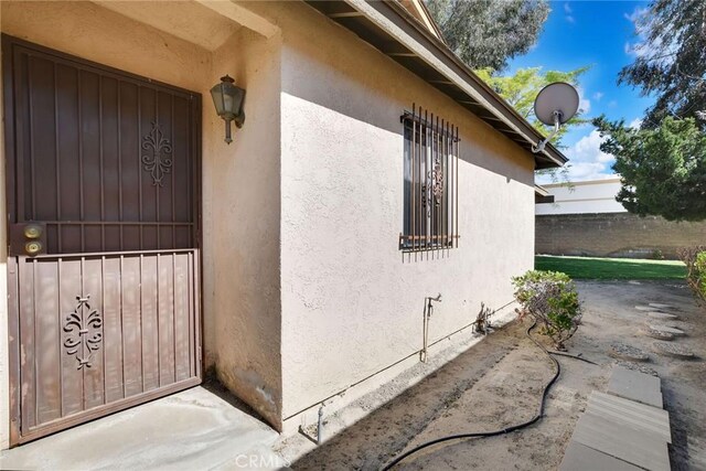 638 W Villa Chaparral Rd, San Jacinto, CA 92583 - view of exterior entry with stucco siding