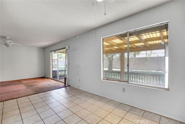 638 W Villa Chaparral Rd, San Jacinto, CA 92583 - empty room with ceiling fan, light carpet, light tile patterned floors, and a textured ceiling