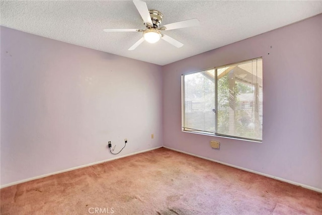 638 W Villa Chaparral Rd, San Jacinto, CA 92583 - spare room featuring light colored carpet, a ceiling fan, a textured ceiling, and baseboards