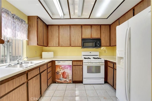 638 W Villa Chaparral Rd, San Jacinto, CA 92583 - kitchen with white appliances, a sink, light countertops, light tile patterned floors, and brown cabinetry