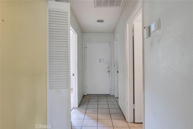638 W Villa Chaparral Rd, San Jacinto, CA 92583 - hallway featuring light tile patterned floors
