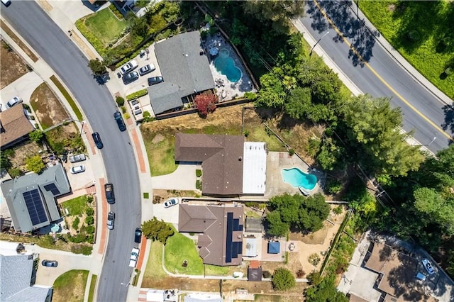 aerial view of property and surrounding area with a pool