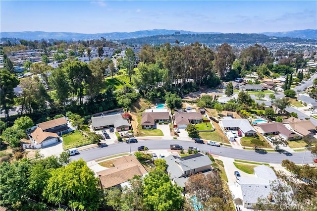 aerial perspective of suburban area with a mountain backdrop