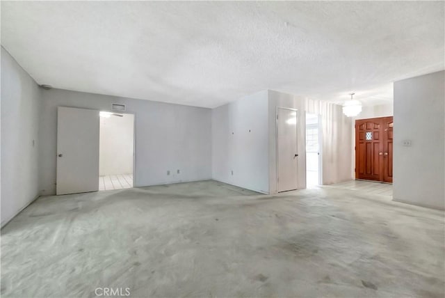 empty room with a textured ceiling