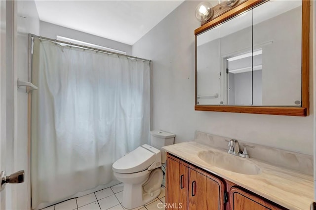 bathroom with tile patterned flooring, toilet, and vanity