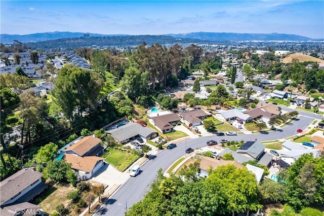 view of property location featuring nearby suburban area and a mountain backdrop