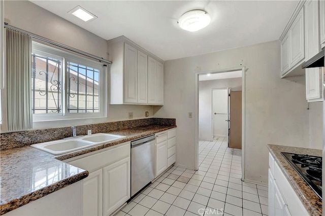 kitchen with dishwasher, a sink, black gas cooktop, light tile patterned flooring, and white cabinets