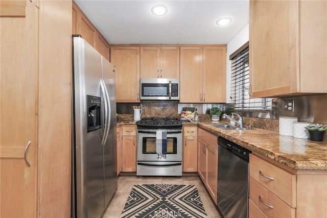 2474 S Centinela Ave Unit 4, Los Angeles, CA 90064 - kitchen with stainless steel appliances, a sink, light brown cabinetry, light tile patterned flooring, and stone counters