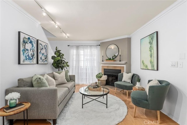 2474 S Centinela Ave Unit 4, Los Angeles, CA 90064 - living room featuring rail lighting, a tiled fireplace, and crown molding