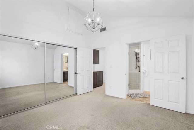 2474 S Centinela Ave Unit 4, Los Angeles, CA 90064 - unfurnished bedroom featuring light carpet, a chandelier, high vaulted ceiling, baseboards, and a closet