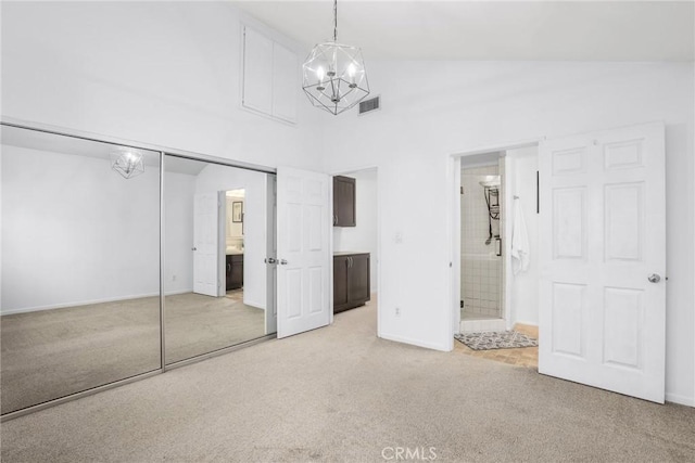 2474 S Centinela Ave Unit 4, Los Angeles, CA 90064 - unfurnished bedroom featuring light carpet, a chandelier, high vaulted ceiling, a closet, and ensuite bathroom