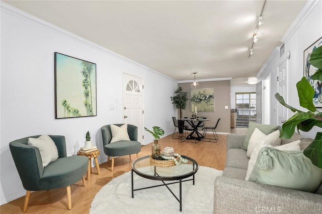 2474 S Centinela Ave Unit 4, Los Angeles, CA 90064 - living area featuring track lighting, crown molding, light wood-style floors, and baseboards