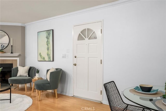 2474 S Centinela Ave Unit 4, Los Angeles, CA 90064 - sitting room with light wood-type flooring, ornamental molding, a tile fireplace, and baseboards