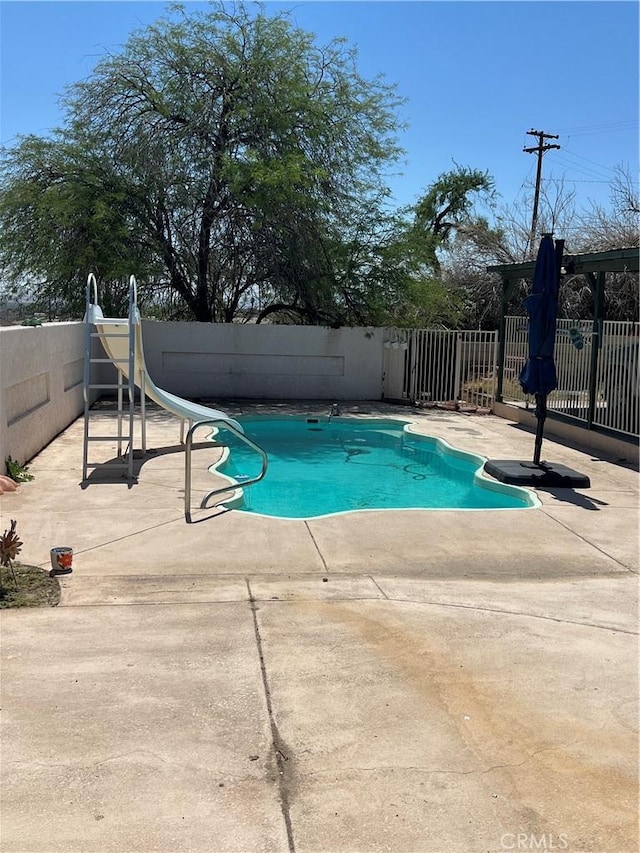 525 S L St, Needles, CA 92363 - view of pool featuring a water slide and a patio area