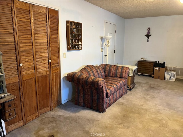 525 S L St, Needles, CA 92363 - living area featuring light carpet and a textured ceiling