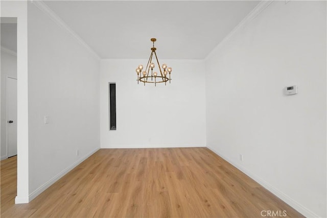 14844 Dickens St Unit 306, Sherman Oaks, CA 91403 - unfurnished room with light wood-style flooring, a chandelier, ornamental molding, and baseboards