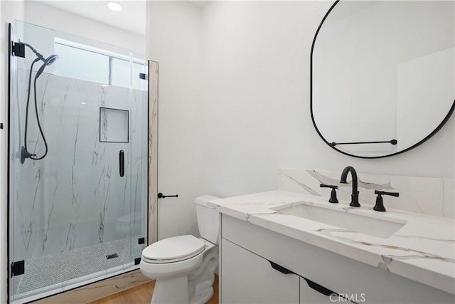 14844 Dickens St Unit 306, Sherman Oaks, CA 91403 - bathroom with a marble finish shower, toilet, vanity, wood finished floors, and recessed lighting