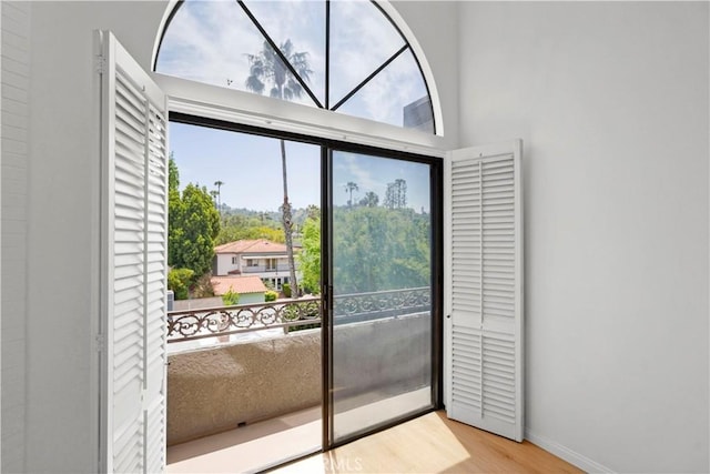 14844 Dickens St Unit 306, Sherman Oaks, CA 91403 - doorway to outside featuring wood finished floors and baseboards