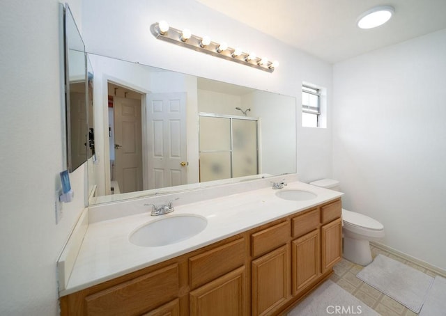 6933 Rio Grande Dr, Eastvale, CA 91752 - full bath with toilet, a shower stall, and double vanity