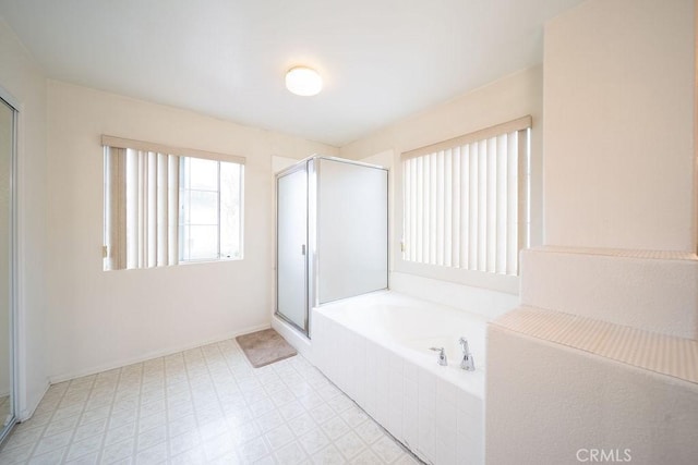 6933 Rio Grande Dr, Eastvale, CA 91752 - full bathroom with a garden tub, a stall shower, baseboards, and tile patterned floors