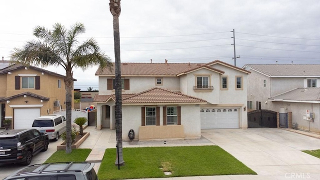 6933 Rio Grande Dr, Eastvale, CA 91752 - mediterranean / spanish home featuring stucco siding, a gate, a garage, driveway, and a tiled roof